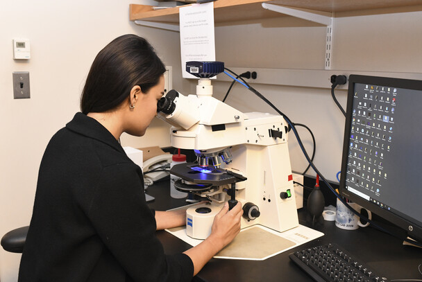 Krissy Lyon peers into a microscope