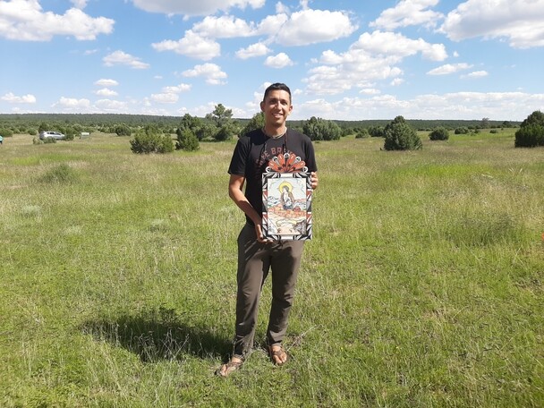 Wade Campbell, PhD ’22, examining ceramics at a 18th century Navajo archaeological site in northwest New Mexico.