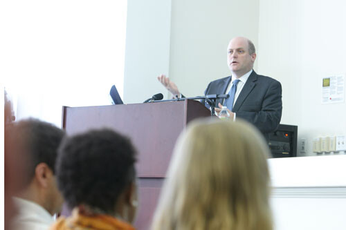 Professor Daniel Schrag speaks at a podium