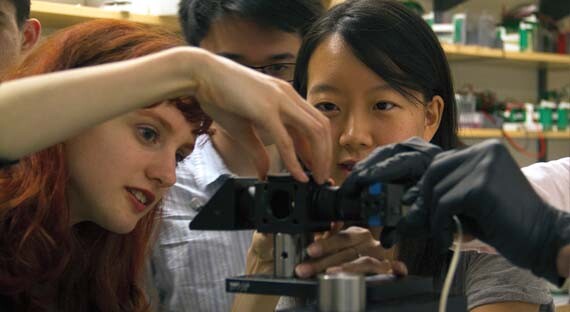 Students making a microscope