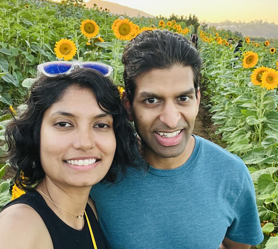 Anshul and Dayita Kumar in front of sunflower fields